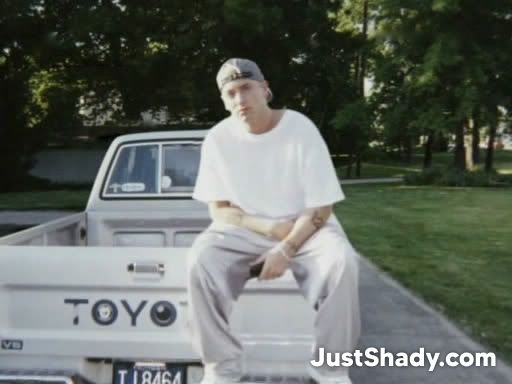 Eminem sitting on a toyota | JustShady.com